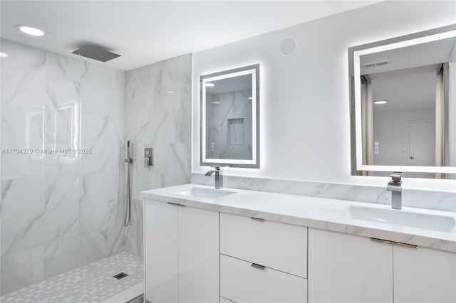 853 SW 118th Ter, Davie, FL 33325 - full bathroom with double vanity, visible vents, a marble finish shower, and a sink