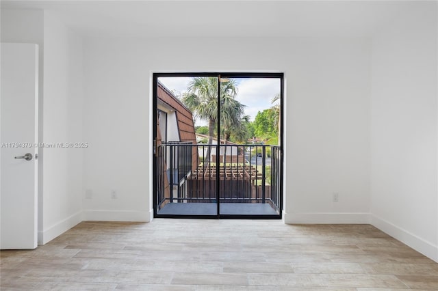 853 SW 118th Ter, Davie, FL 33325 - empty room featuring baseboards and wood finished floors
