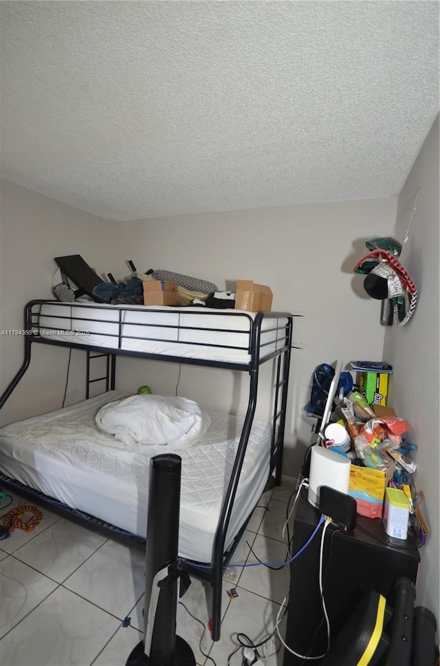 1004 Twin Lakes Dr Unit 1004, Coral Springs, FL 33071 - bedroom with light tile patterned flooring and a textured ceiling