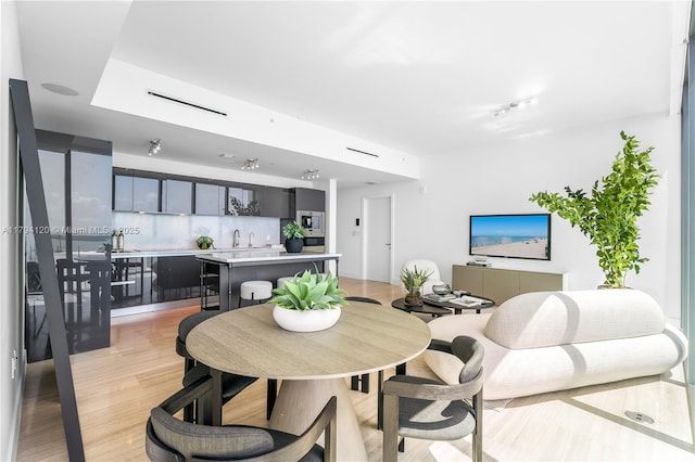 dining room featuring light wood-style flooring