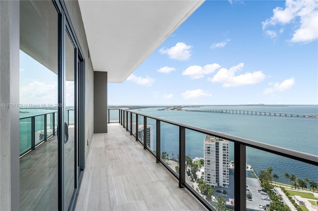 balcony featuring a water view