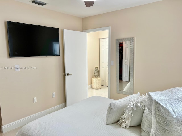 bedroom with baseboards, ceiling fan, and visible vents
