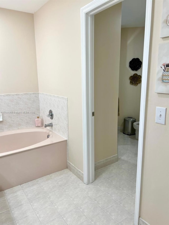 full bathroom with tile patterned floors and a bath