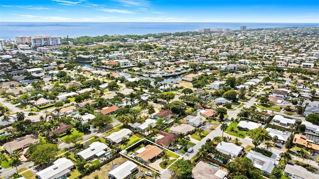 drone / aerial view with a water view, a city view, and a residential view