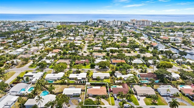 bird's eye view with a residential view and a water view