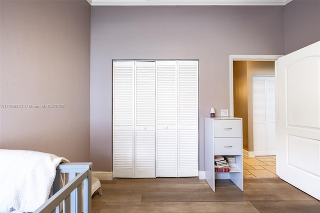 563 Lakeside Cir, Sunrise, FL 33326 - bedroom featuring wood finished floors, a closet, and baseboards