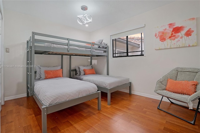 850 NE 182nd Ter, North Miami Beach, FL 33162 - bedroom featuring baseboards and wood finished floors