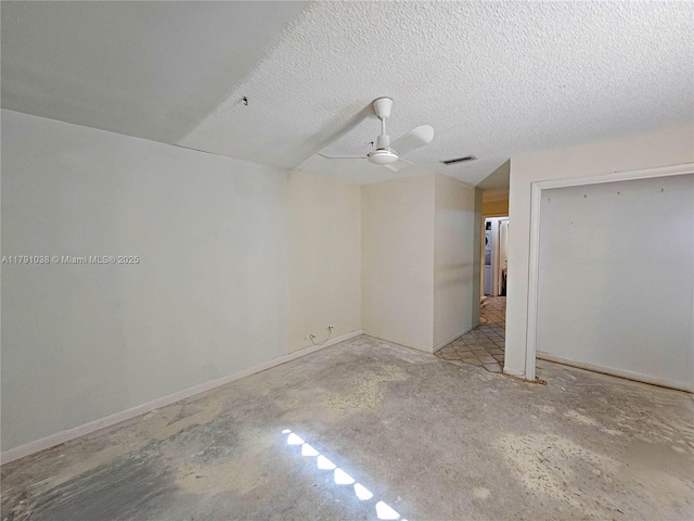 unfurnished bedroom with ceiling fan, visible vents, unfinished concrete floors, baseboards, and a closet