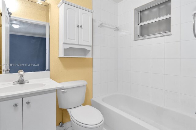 full bath with vanity, tub / shower combination, and toilet
