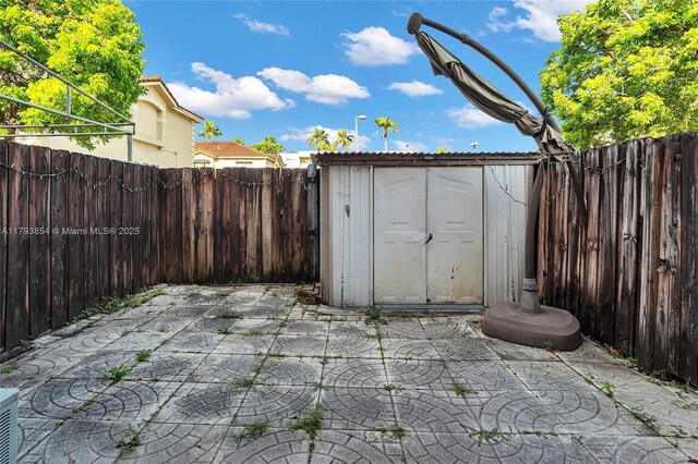 view of shed with a fenced backyard