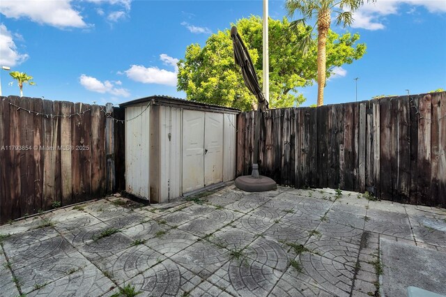 view of shed featuring a fenced backyard