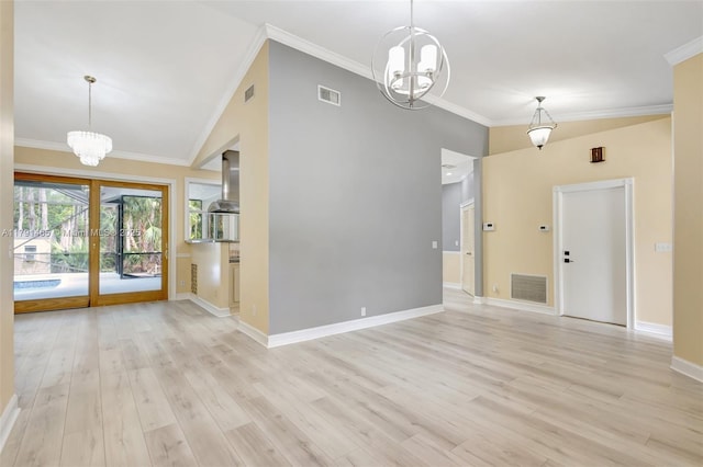 16789 98th Way N, Jupiter, FL 33478 - unfurnished living room featuring a chandelier, crown molding, baseboards, light wood-style floors, and high vaulted ceiling