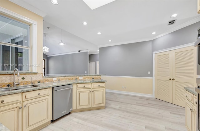 kitchen with visible vents, a sink, dishwasher, and cream cabinets