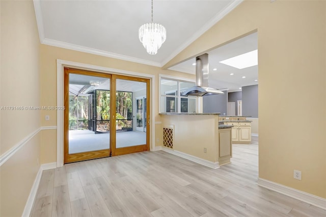 16789 98th Way N, Jupiter, FL 33478 - doorway with ornamental molding, a skylight, light wood-style floors, a chandelier, and baseboards