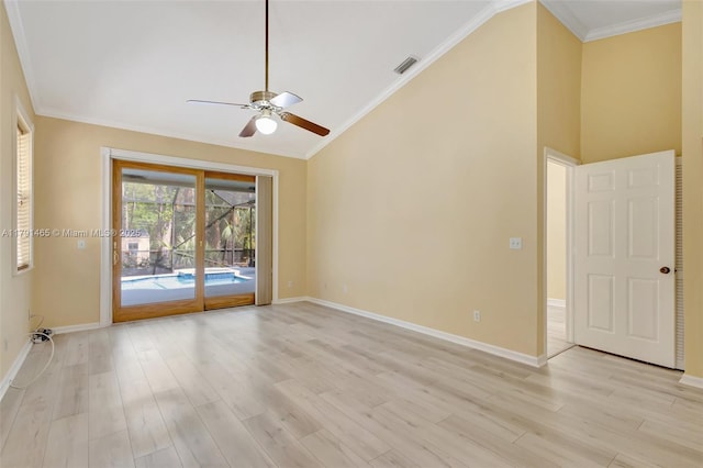 empty room with light wood-style floors, baseboards, ceiling fan, and visible vents