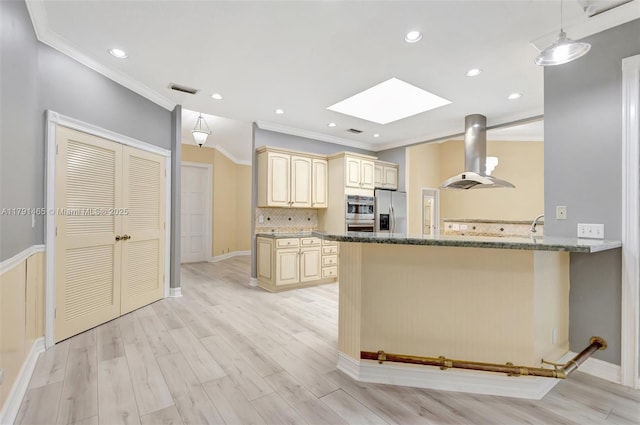 16789 98th Way N, Jupiter, FL 33478 - kitchen featuring extractor fan, stainless steel appliances, a skylight, crown molding, and a peninsula