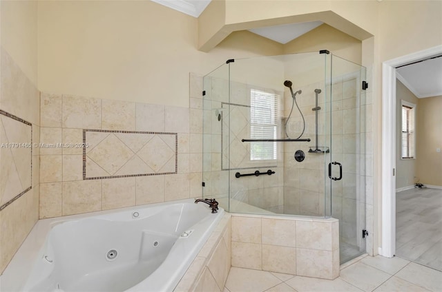 bathroom featuring crown molding, tile patterned flooring, a shower stall, baseboards, and a whirlpool tub