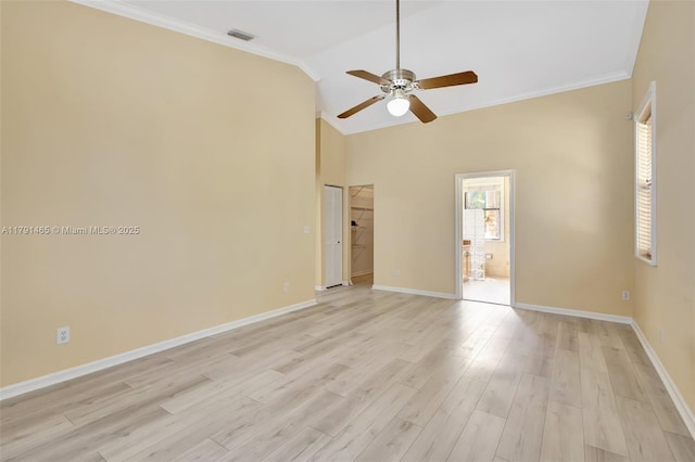 16789 98th Way N, Jupiter, FL 33478 - empty room with a ceiling fan, baseboards, light wood-style flooring, crown molding, and vaulted ceiling
