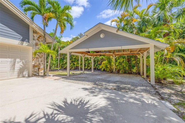 16789 98th Way N, Jupiter, FL 33478 - view of parking / parking lot featuring gravel driveway and a detached carport