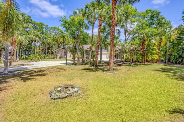 16789 98th Way N, Jupiter, FL 33478 - view of grassy yard featuring a fire pit
