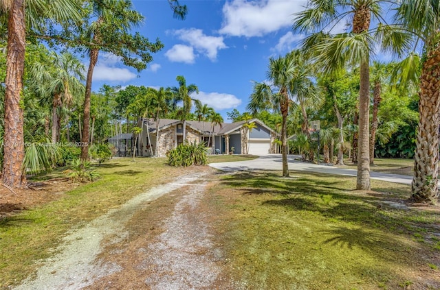 16789 98th Way N, Jupiter, FL 33478 - view of front of property with driveway, a garage, and a front yard