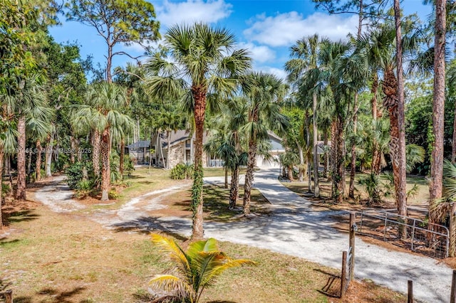 16789 98th Way N, Jupiter, FL 33478 - view of home's community featuring dirt driveway and fence