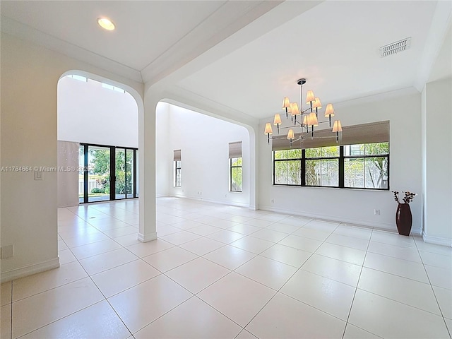 spare room with visible vents, baseboards, light tile patterned floors, and a notable chandelier