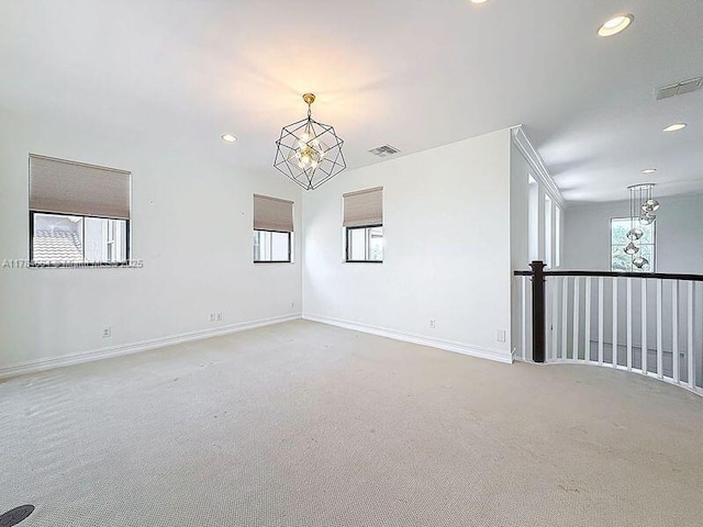 spare room with light colored carpet, baseboards, visible vents, and recessed lighting