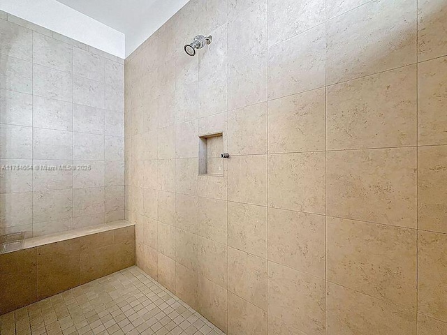 full bath featuring a tile shower