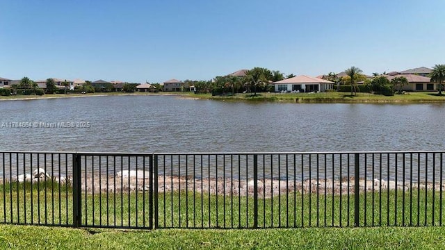 water view featuring fence and a residential view