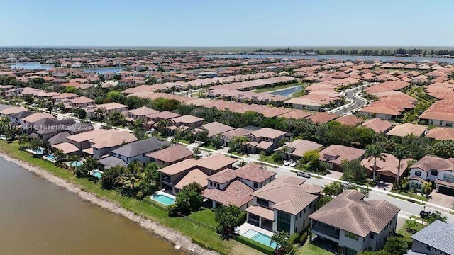 aerial view with a residential view and a water view