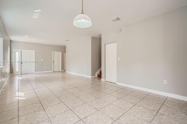 1107 NE 41st Ave, Homestead, FL 33033 - spare room with stairs, light tile patterned flooring, baseboards, and visible vents