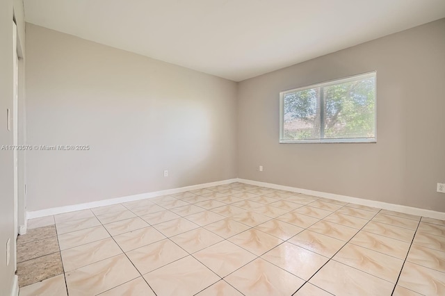1107 NE 41st Ave, Homestead, FL 33033 - spare room featuring baseboards