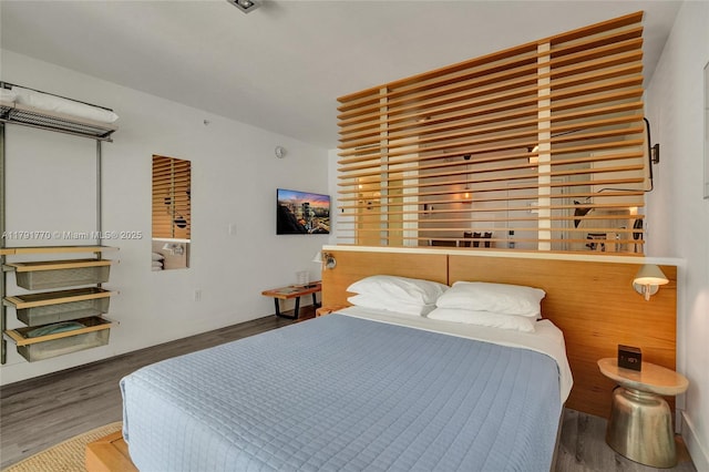 bedroom with wood finished floors