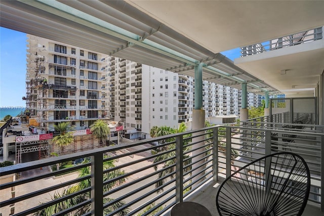 balcony featuring a water view