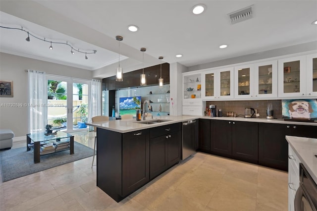 kitchen featuring a sink, white cabinetry, stainless steel dishwasher, visible vents, and ornamental molding