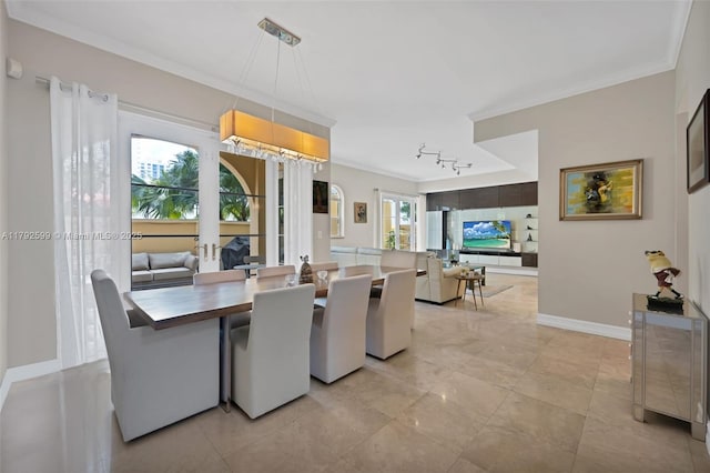 dining area featuring baseboards and ornamental molding