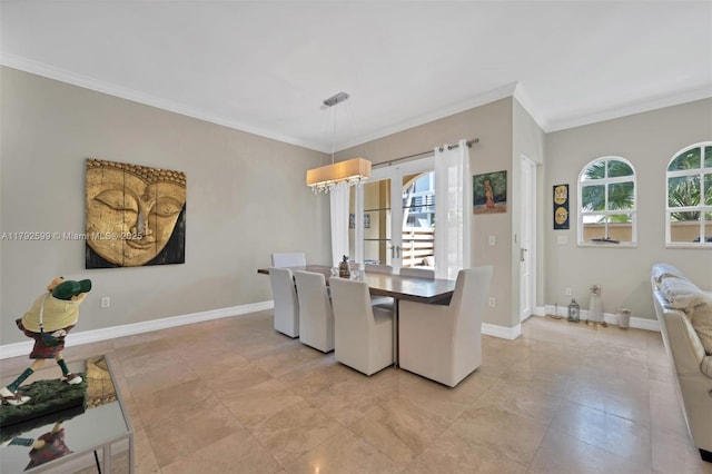 dining area with crown molding and baseboards