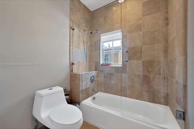 full bath featuring toilet and enclosed tub / shower combo