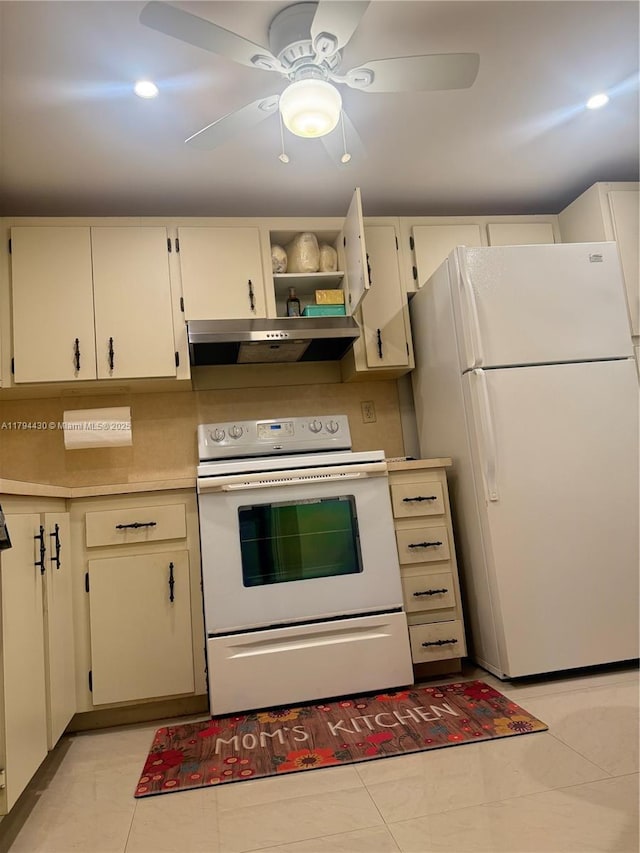 kitchen with light tile patterned flooring, ceiling fan, white appliances, light countertops, and under cabinet range hood