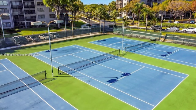 901 Colony Point Cir Unit 217, Pembroke Pines, FL 33026 - view of tennis court with fence and community basketball court