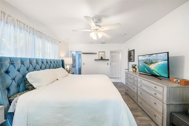 bedroom with ceiling fan and wood finished floors
