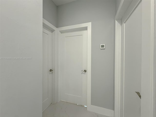 417 Paddock St, Lehigh Acres, FL 33974 - hallway with light marble finish floors