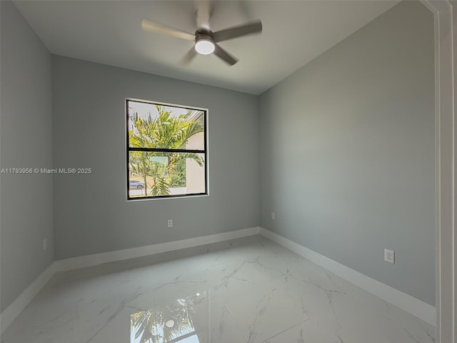 417 Paddock St, Lehigh Acres, FL 33974 - unfurnished room featuring light marble finish floors, baseboards, and ceiling fan