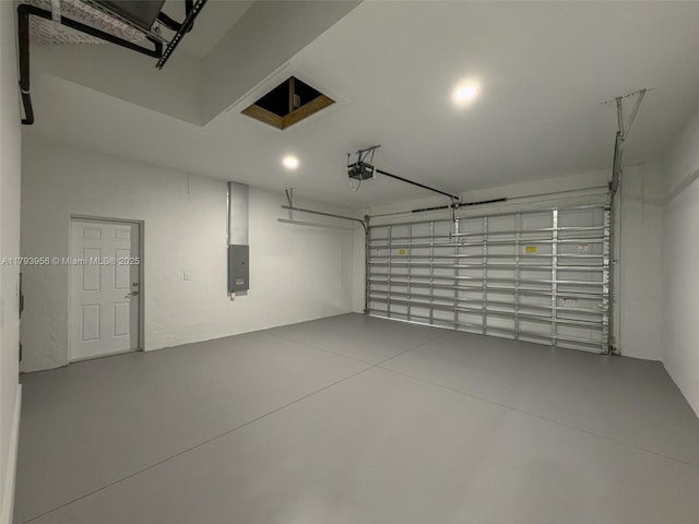 417 Paddock St, Lehigh Acres, FL 33974 - garage with a garage door opener, electric panel, and recessed lighting