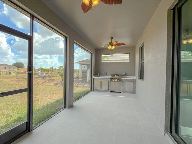 417 Paddock St, Lehigh Acres, FL 33974 - unfurnished sunroom with ceiling fan and area for grilling