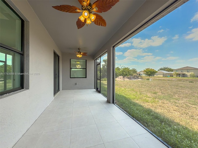 417 Paddock St, Lehigh Acres, FL 33974 - unfurnished sunroom featuring ceiling fan