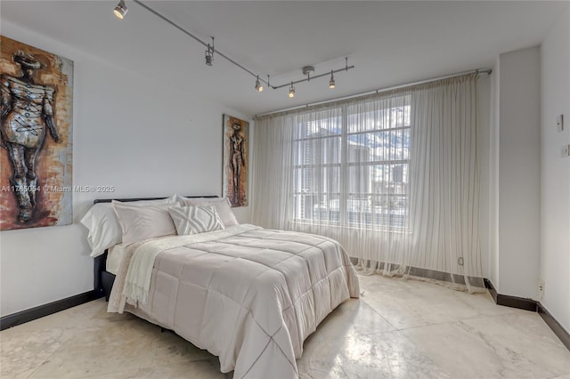 bedroom featuring baseboards