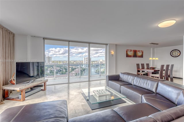 living room featuring a wall of windows