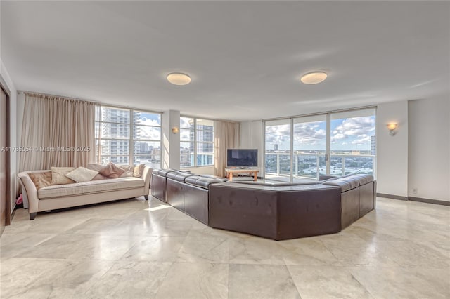 living room featuring a wall of windows